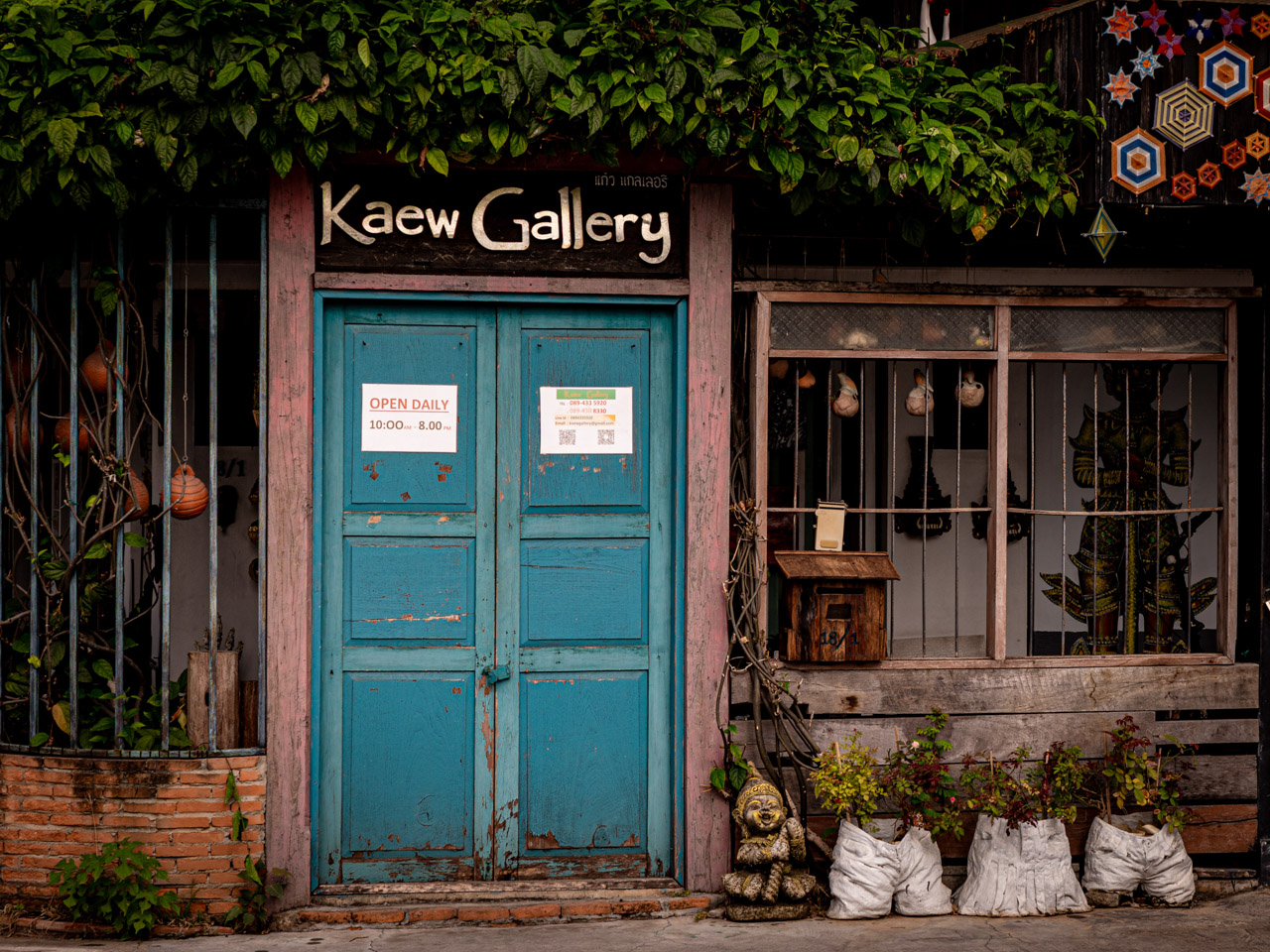 Kaew Gallery in the old town of Chiang Mai, surrounded by lush tropical greenery